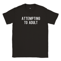 Black slogan tshirt which says Attempting to Adult on white background
